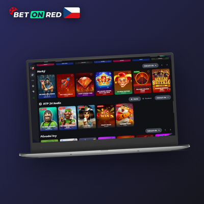 Hráč se sluchátky u stolního PC s desktopovou aplikací Betonred Casino doma